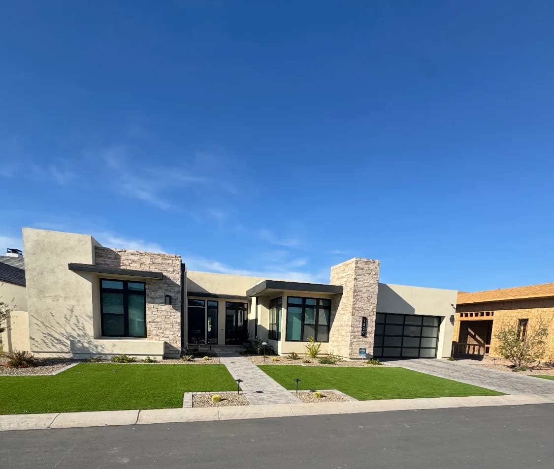 Modern home with turf lawn & paver walkways