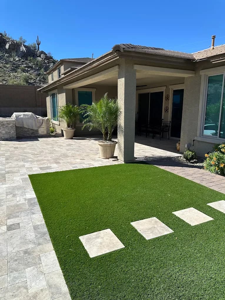 Travertine patio with turf inlay